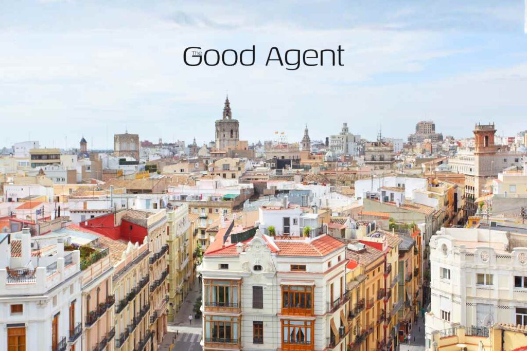 Aerial view of Valencia's historic skyline with The Good Agent logo